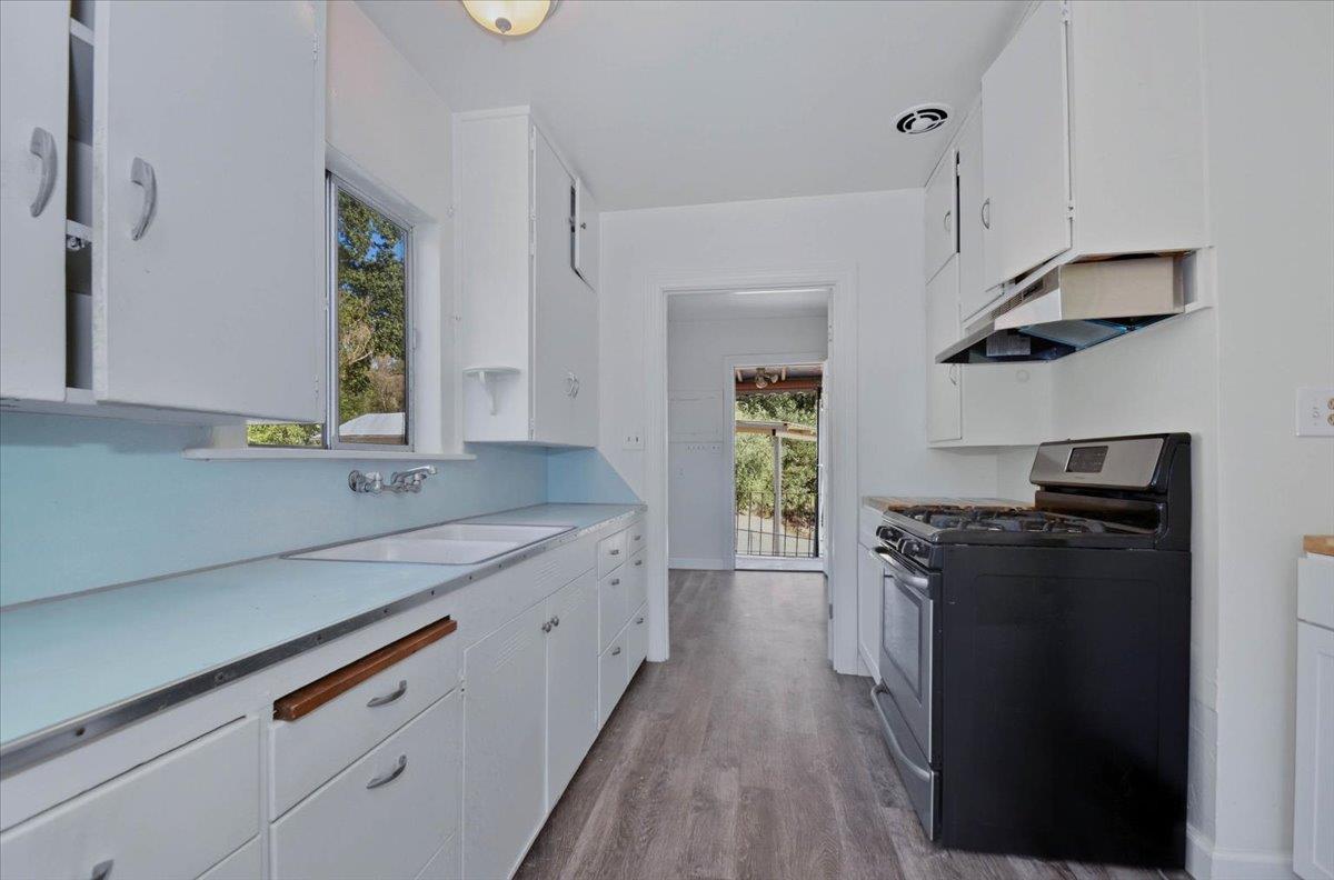 90 Gopher Flat Road Sutter Creek, CA 95685 - Photo 20 of 43 a kitchen with stainless steel appliances granite countertop a sink a stove and a refrigerator