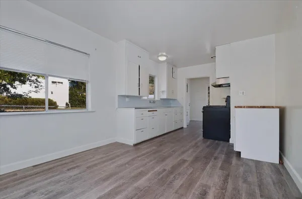 a view of an empty room and closet area