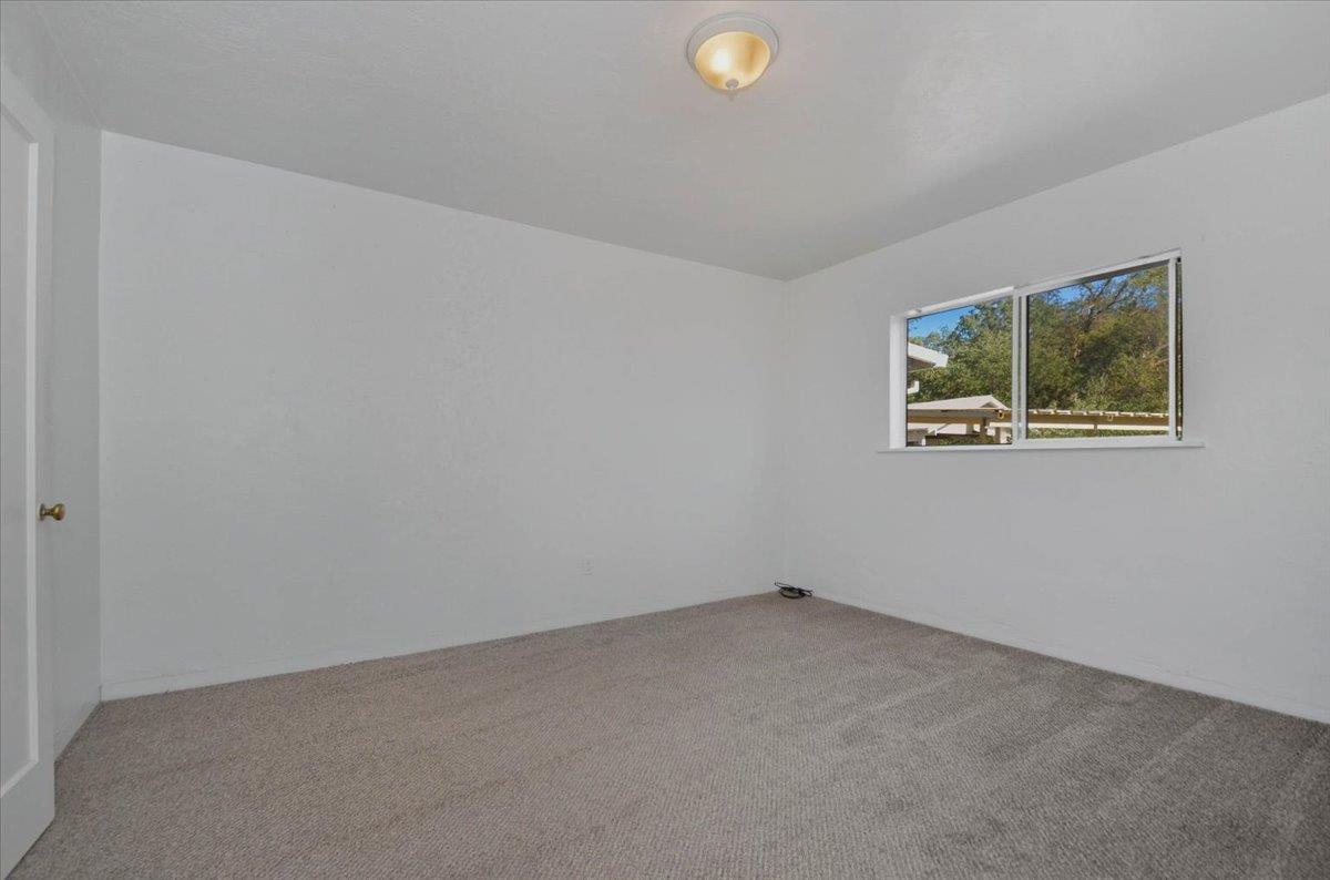 90 Gopher Flat Road Sutter Creek, CA 95685 - Photo 29 of 43 an empty room with windows