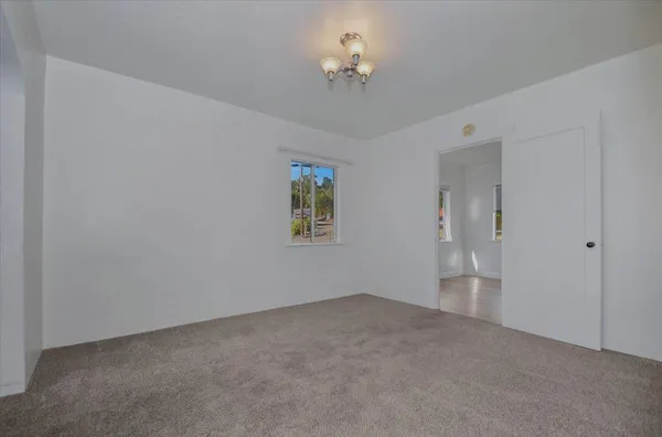 a swimming pool with outdoor seating and yard