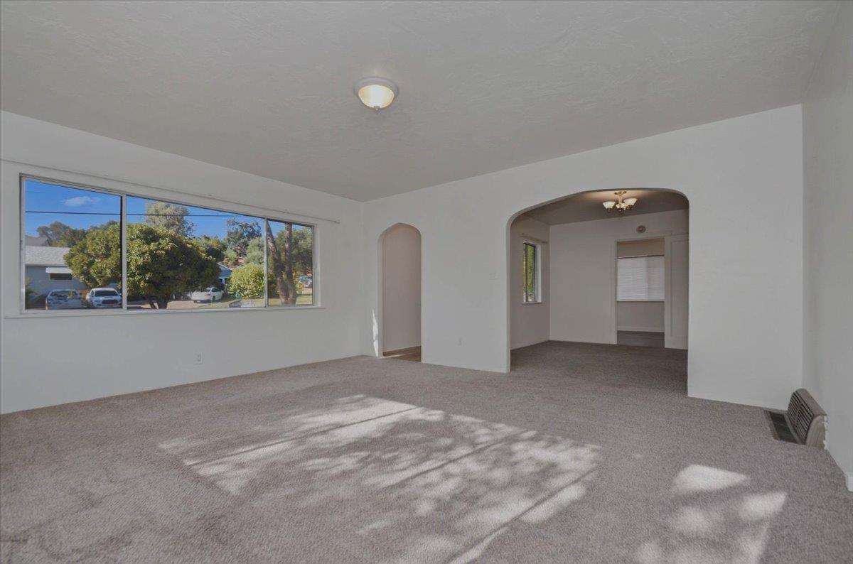 90 Gopher Flat Road Sutter Creek, CA 95685 - Photo 9 of 43 an empty room with windows