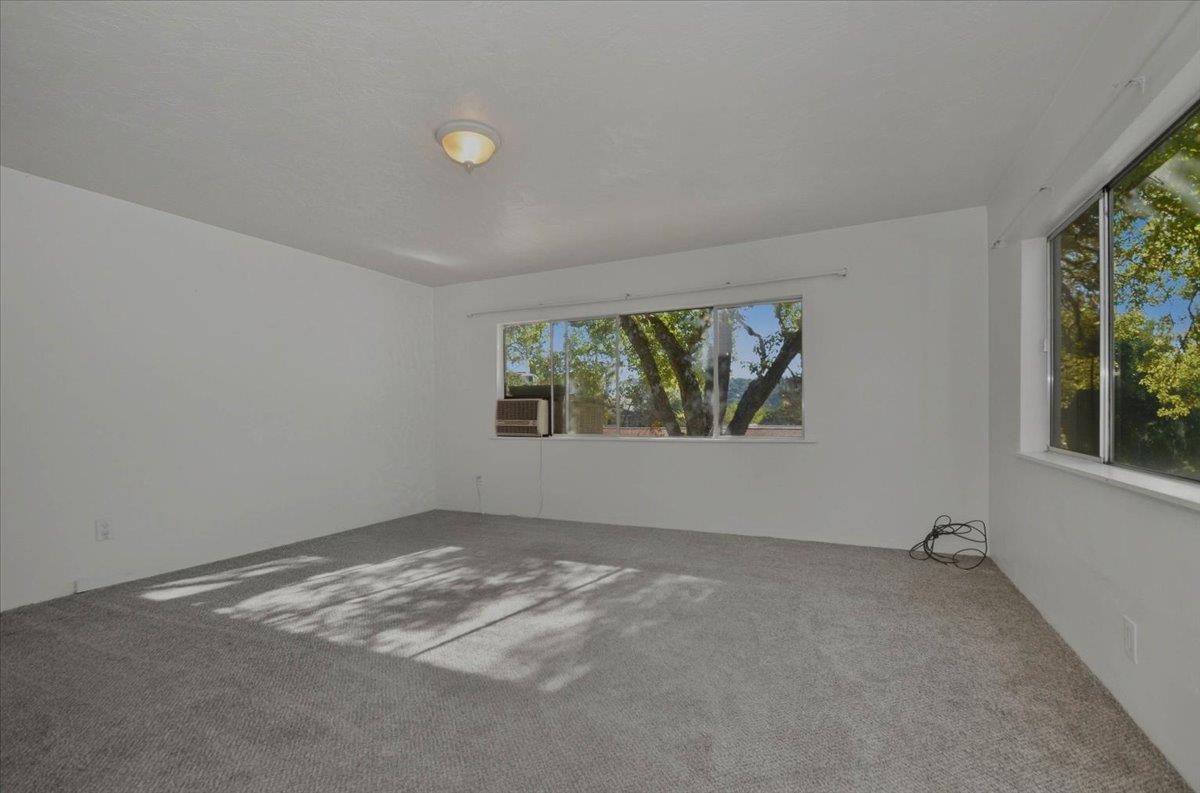 90 Gopher Flat Road Sutter Creek, CA 95685 - Photo 10 of 43 an empty room with windows