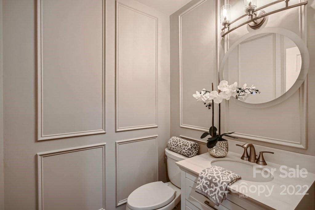 8000 Rising Meadow Road Charlotte, NC 28277 - Photo 14 of 28 a bathroom with a toilet sink and mirror