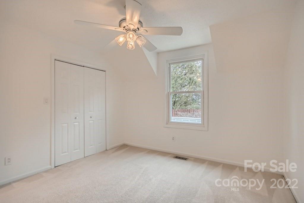 8000 Rising Meadow Road Charlotte, NC 28277 - Photo 20 of 28 an empty room with windows and fan