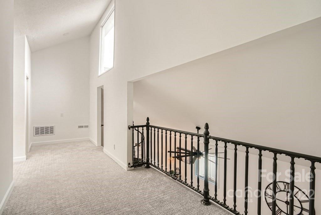 8000 Rising Meadow Road Charlotte, NC 28277 - Photo 24 of 28 a view of a hallway with a window