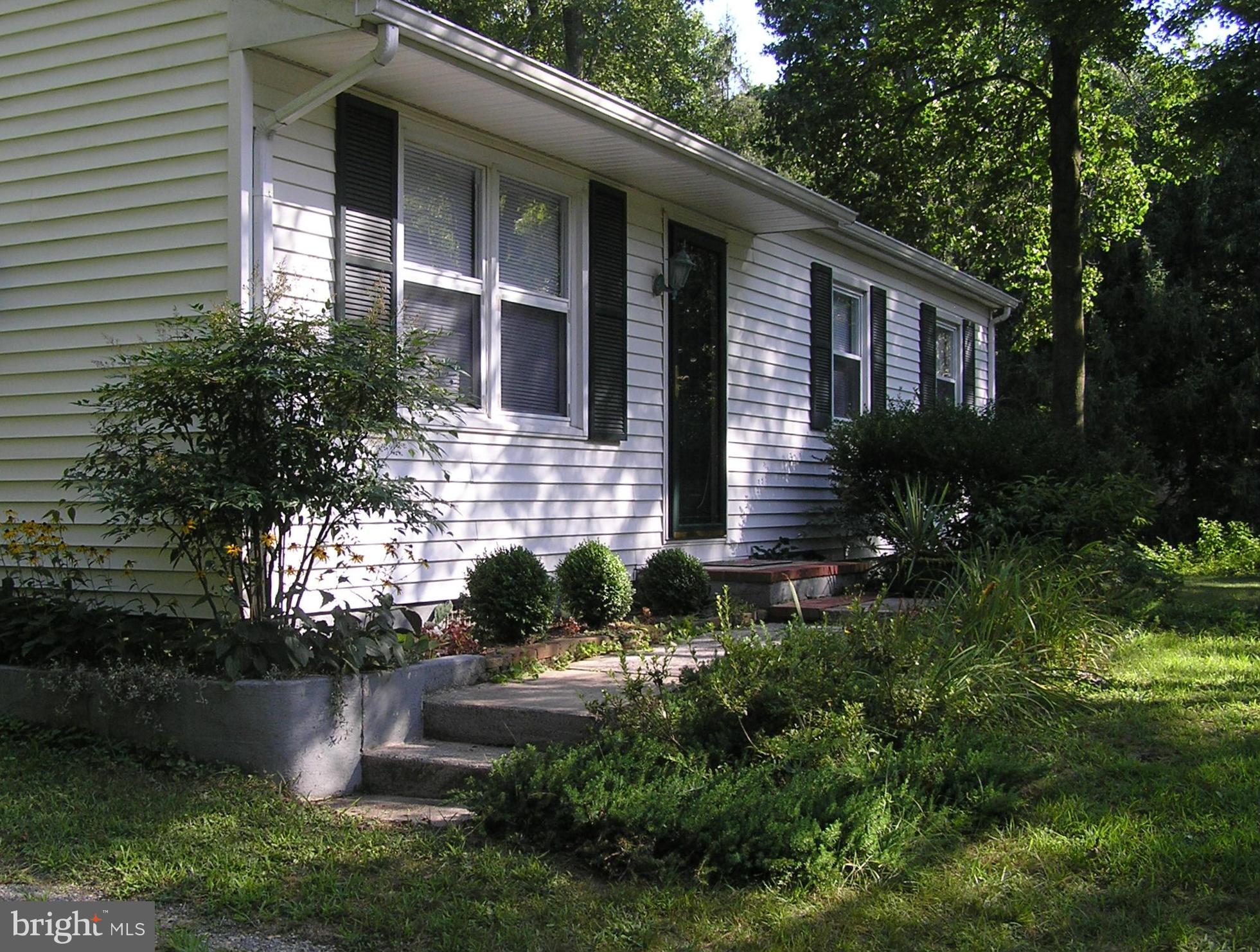 4611 Bethlehem Road Preston, MD 21655 - Photo 2 of 26 a front view of a house with garden