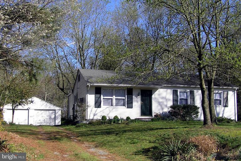 4611 Bethlehem Road Preston, MD 21655 - Photo 3 of 26 a front view of a house with a garden