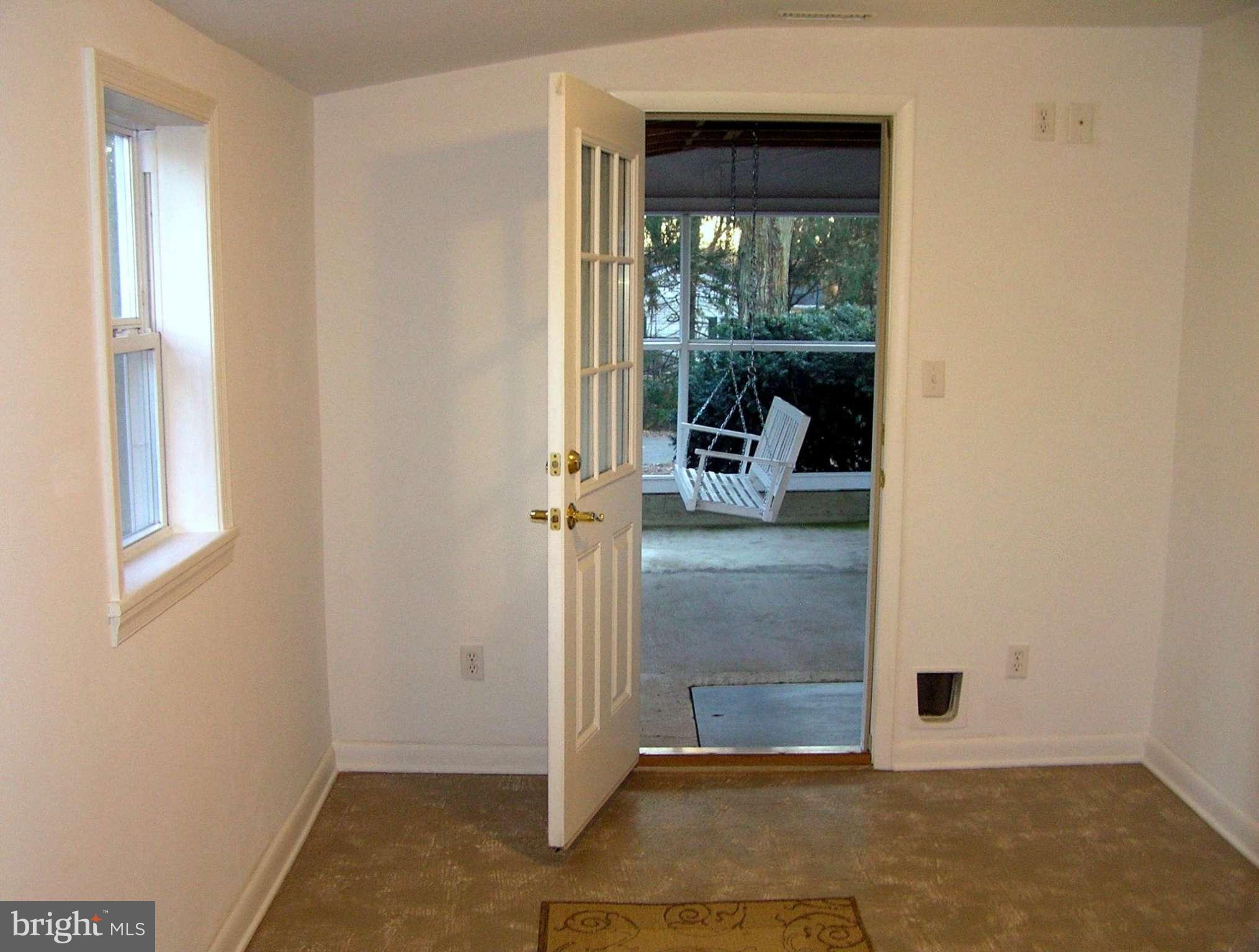 4611 Bethlehem Road Preston, MD 21655 - Photo 21 of 26 a view of a room that has a door and a window