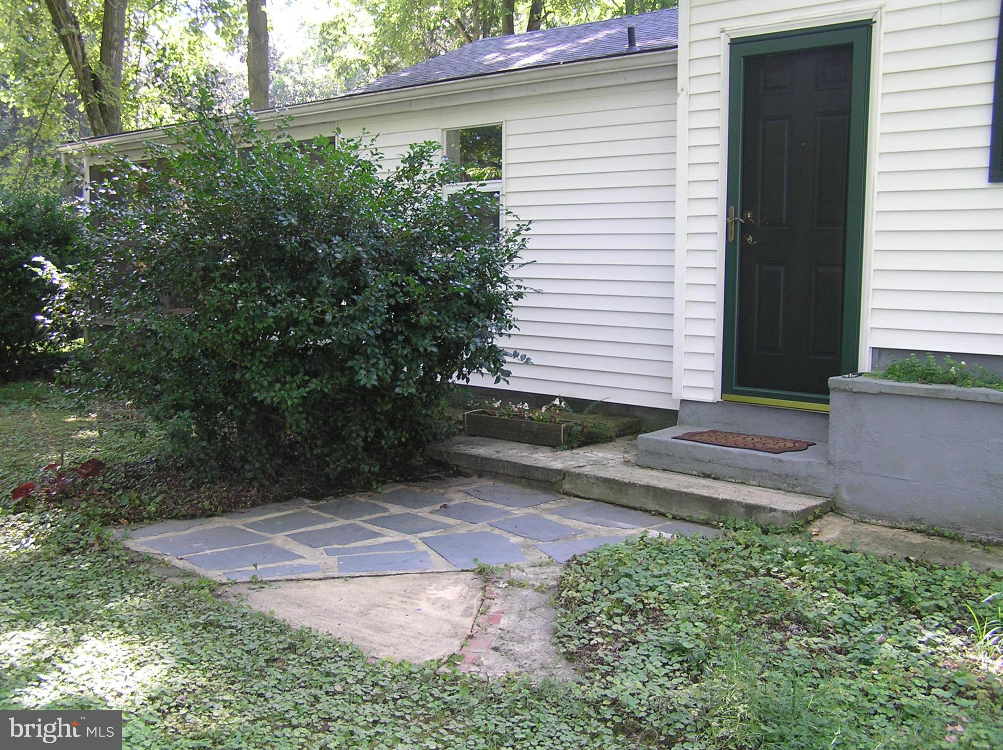 4611 Bethlehem Road Preston, MD 21655 - Photo 7 of 26 a view of a backyard with plants and large tree