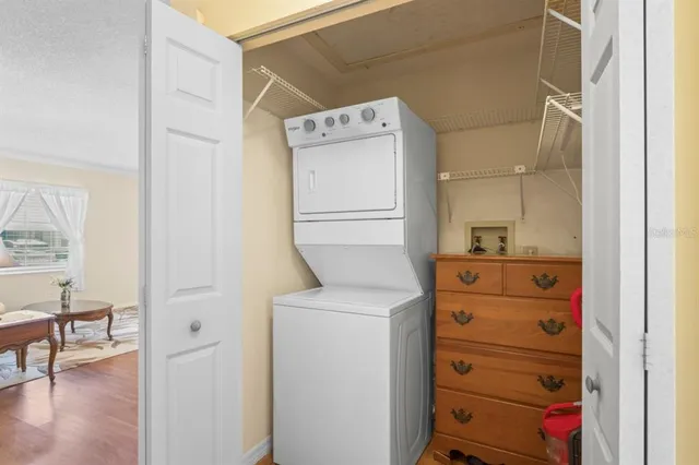 a utility room with closet dryer and washer