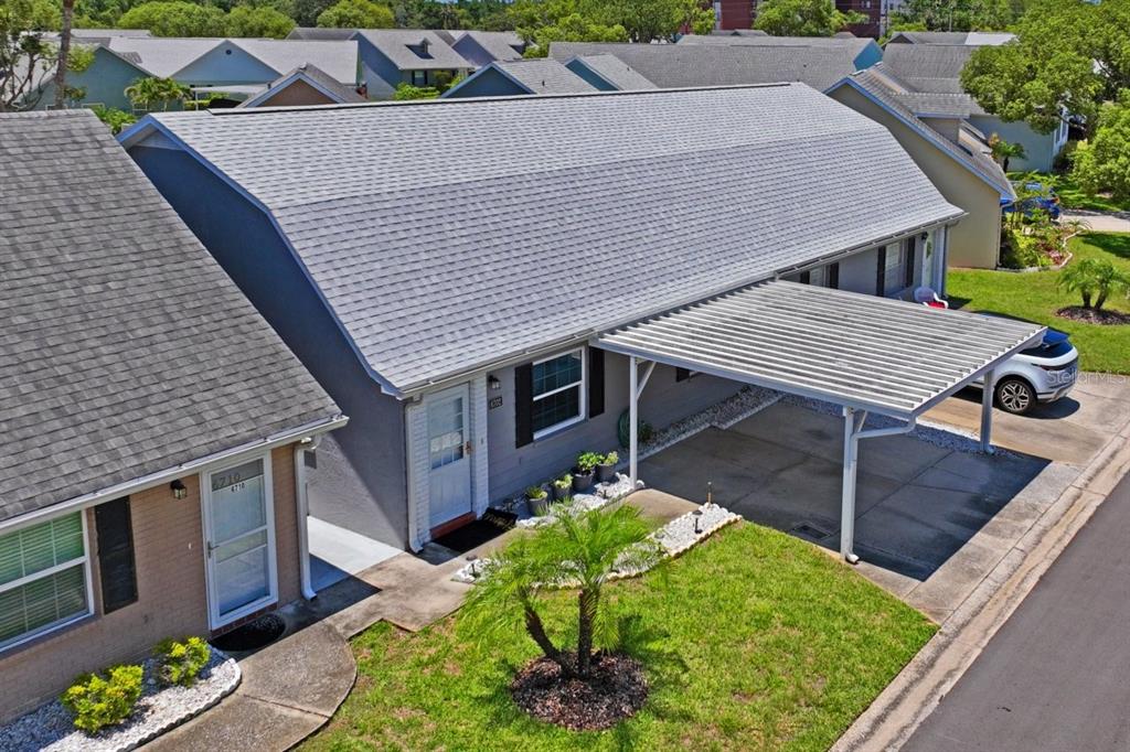 6702 Dartmoor Lane, Unit 7A New Port Richey, FL 34653 - Photo 22 of 40 a house view with a seating space