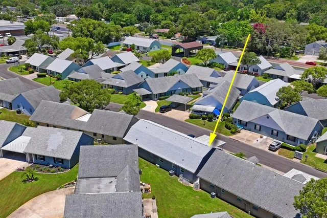 an aerial view of a house with a garden
