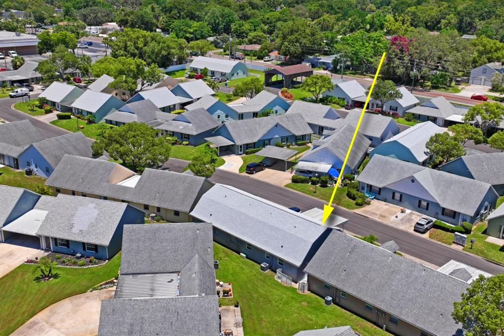 6702 Dartmoor Lane, Unit 7A New Port Richey, FL 34653 - Photo 23 of 40 an aerial view of a house with a garden