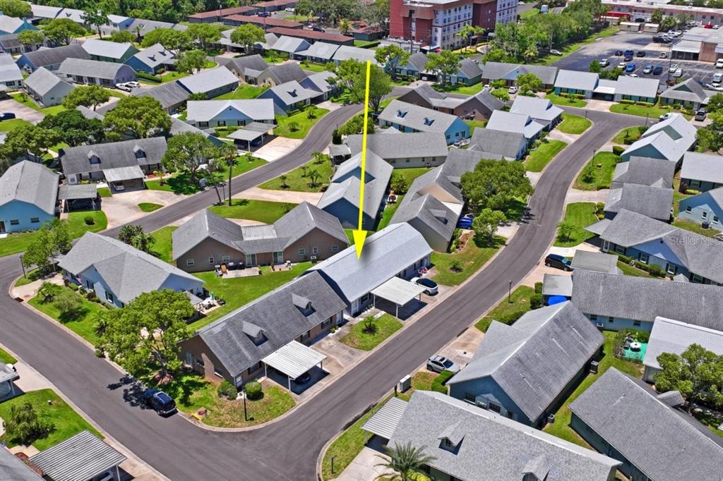 6702 Dartmoor Lane, Unit 7A New Port Richey, FL 34653 - Photo 24 of 40 an aerial view of residential houses with outdoor space
