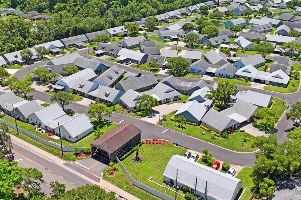 6702 Dartmoor Lane, Unit 7A New Port Richey, FL 34653 - Photo 26 of 40 an aerial view of a house with a garden