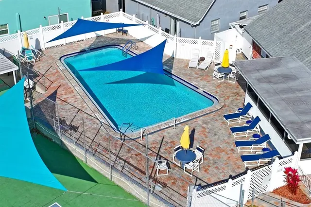 a view of an chairs in the backyard