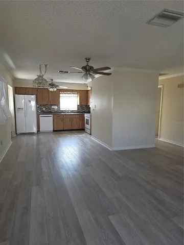 a view of a livingroom with wooden floor