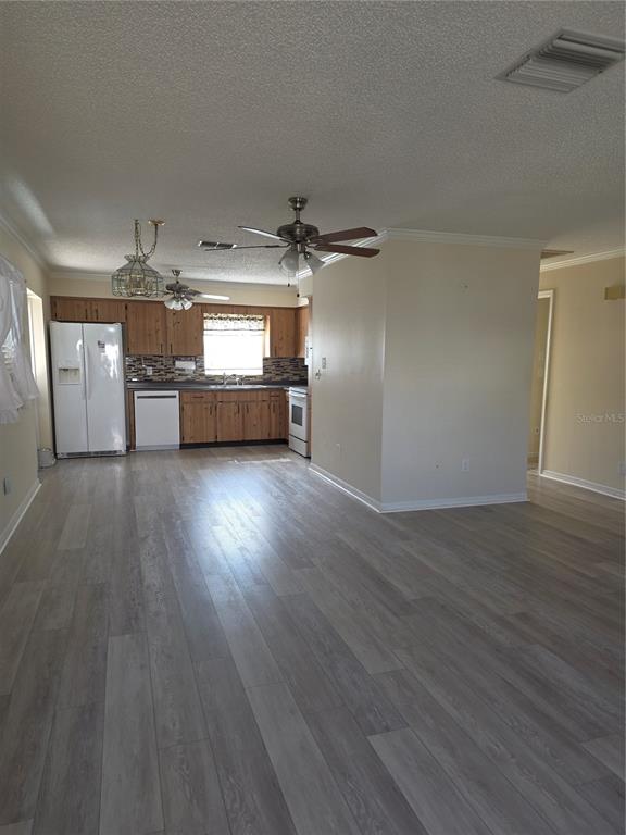 6702 Dartmoor Lane, Unit 7A New Port Richey, FL 34653 - Photo 4 of 40 a view of a livingroom with wooden floor
