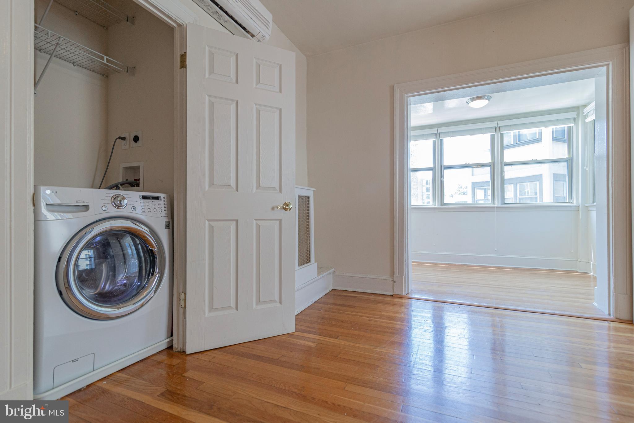 1910 Kalorama Road Northwest, Unit 307 Washington, DC 20009 - Photo 15 of 19 a view of empty room with wooden floor and fan