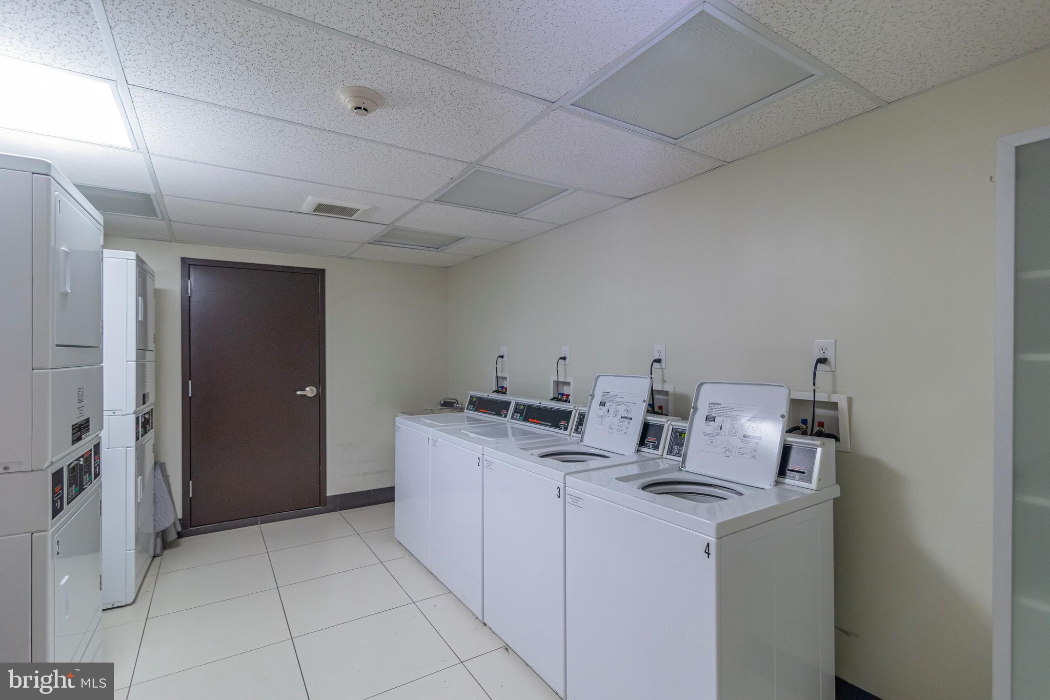 1910 Kalorama Road Northwest, Unit 307 Washington, DC 20009 - Photo 18 of 19 a utility room with dryer and washer