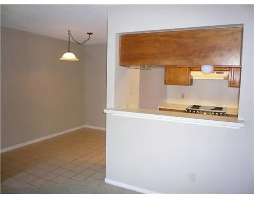 a kitchen with a refrigerator a stove top oven a sink and dishwasher