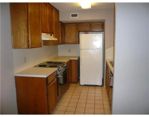 a view of a hallway with closet and wooden floor