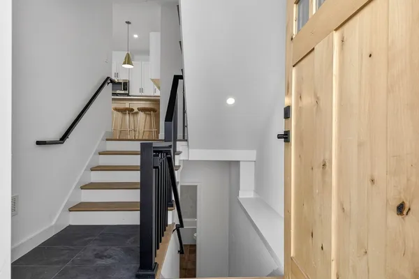 a view of entryway with wooden floor