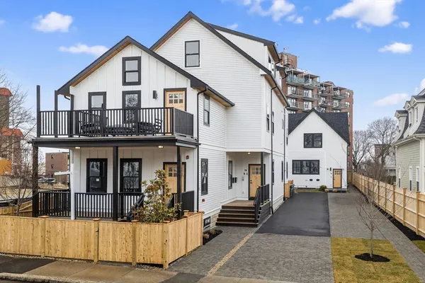 a view of front door and small yard