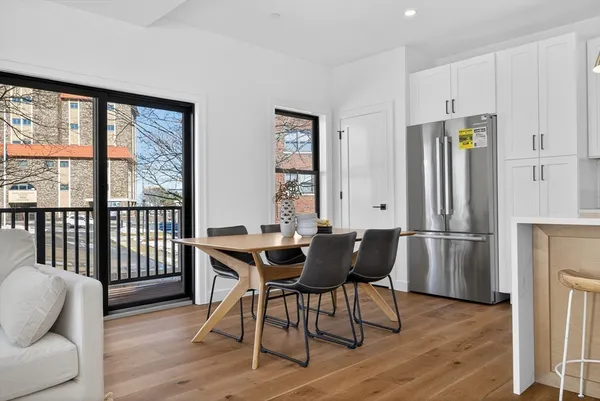 a dining room with furniture and window