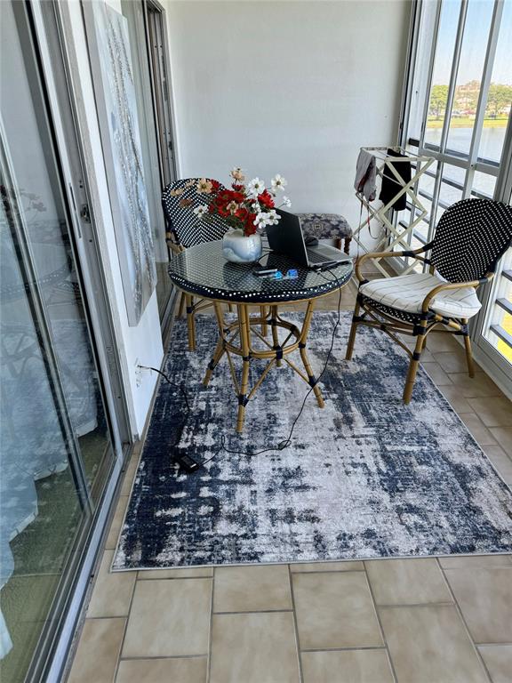 4054 Exeter, Unit C Boca Raton, FL 33434 - Photo 10 of 13 a living room with furniture and a rug