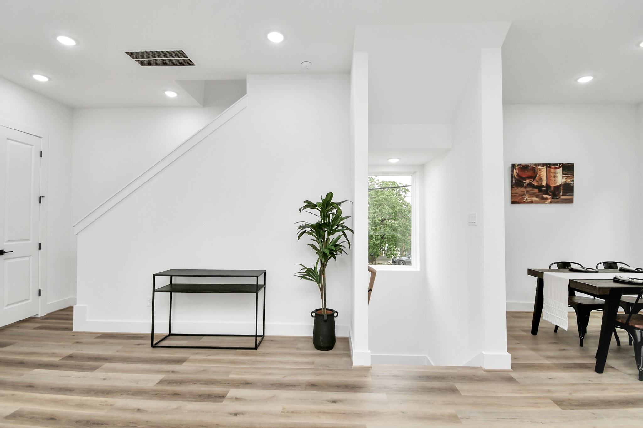 4804 Elysian Street, Unit D Houston, TX 77009 - Photo 23 of 44 a view of a hallway with wooden floor and a potted plant