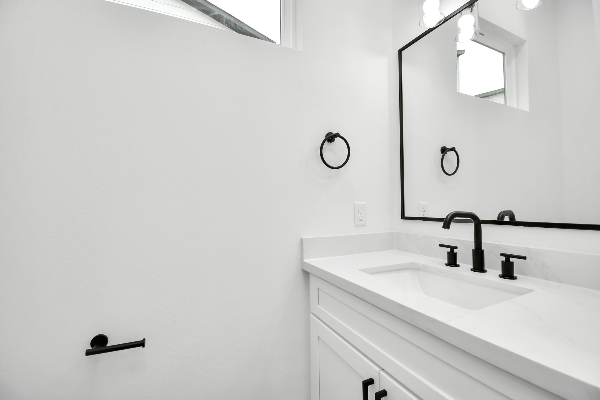 4804 Elysian Street, Unit D Houston, TX 77009 - Photo 24 of 44 a bathroom with a sink and a mirror