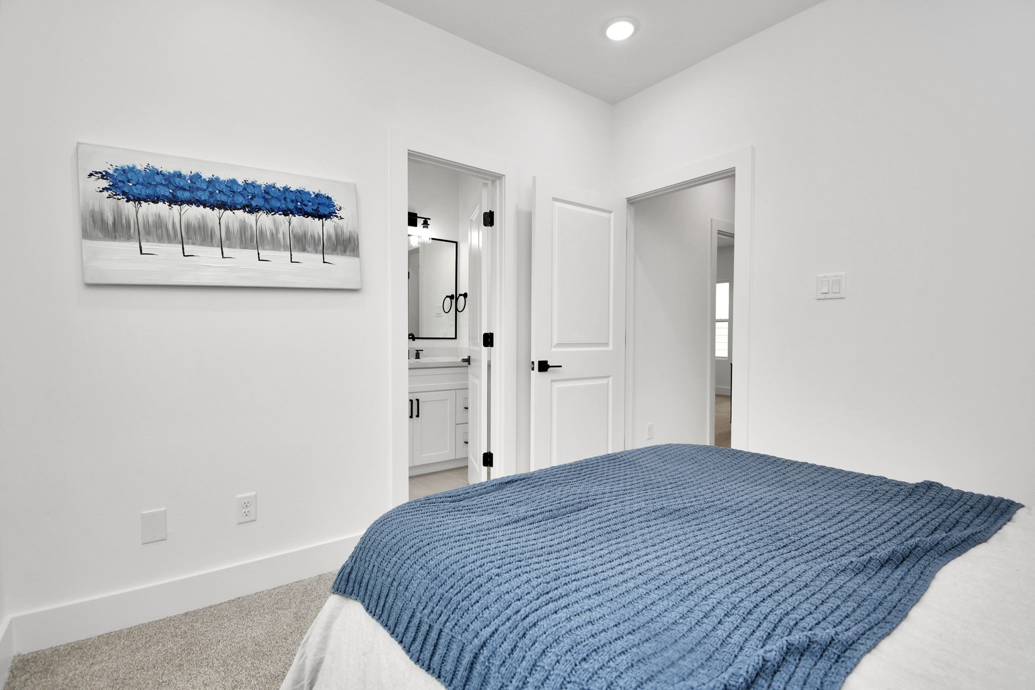 4804 Elysian Street, Unit D Houston, TX 77009 - Photo 36 of 44 a bedroom with a bed and a wall painting