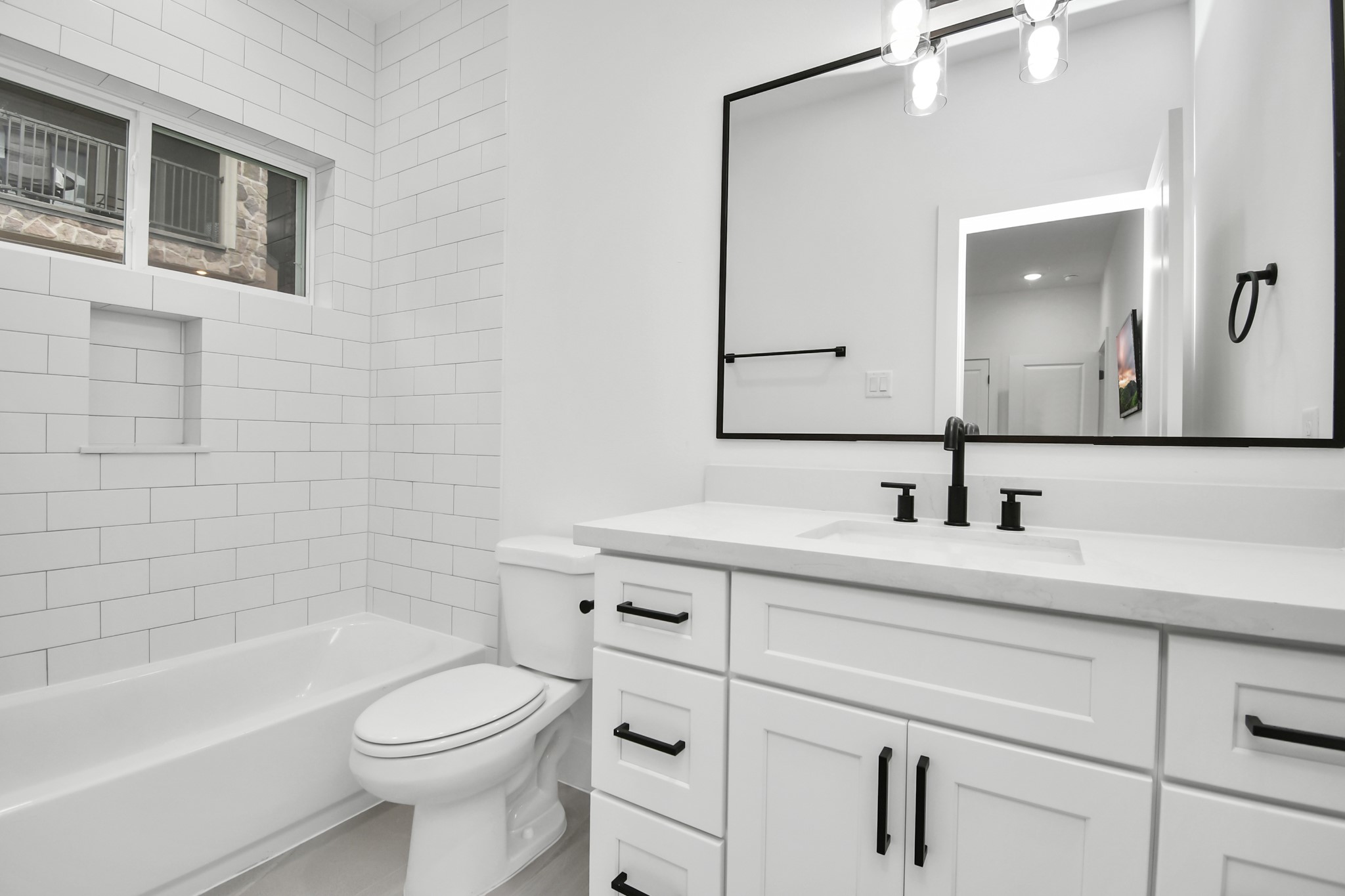 4804 Elysian Street, Unit D Houston, TX 77009 - Photo 5 of 44 a bathroom with a sink a toilet and shower