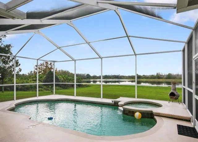 a view of a swimming pool with a porch