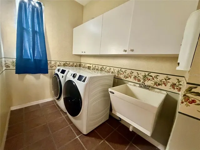 a utility room with dryer and washer