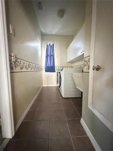 a bathroom with a shower and a sink