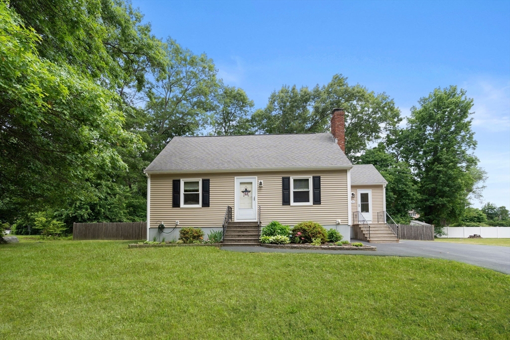 9 Laurel Lane Bellingham, MA 02019 - Photo 2 of 30 a front view of house with yard and trees