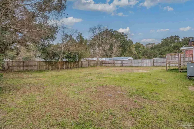 a view of a lake with houses in the back