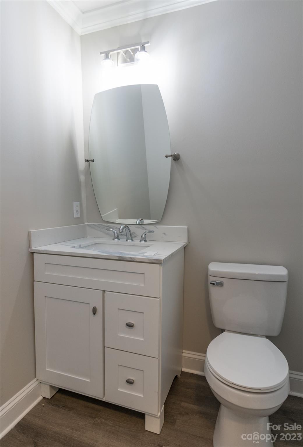 1531 Ruth Street, Unit 2 Lancaster, SC 29720 - Photo 13 of 33 a bathroom with a toilet sink and mirror