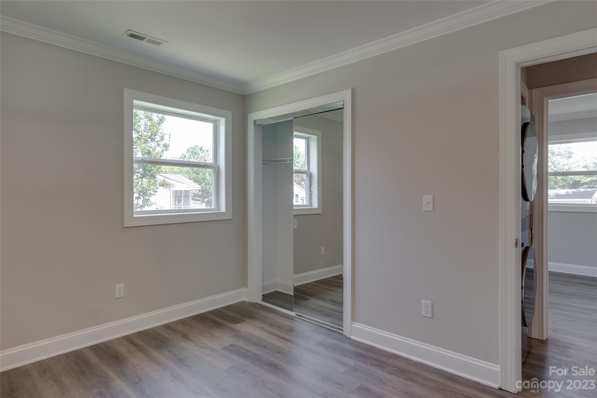 1531 Ruth Street, Unit 2 Lancaster, SC 29720 - Photo 17 of 33 an empty room with wooden floor and a window