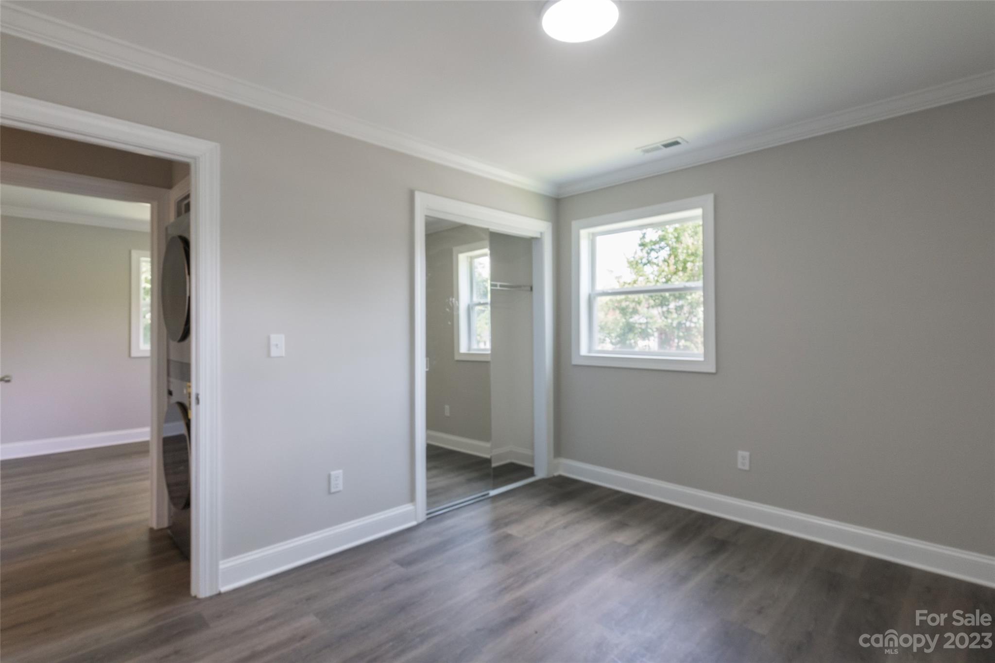 1531 Ruth Street, Unit 2 Lancaster, SC 29720 - Photo 22 of 33 a view of an empty room with wooden floor and a window