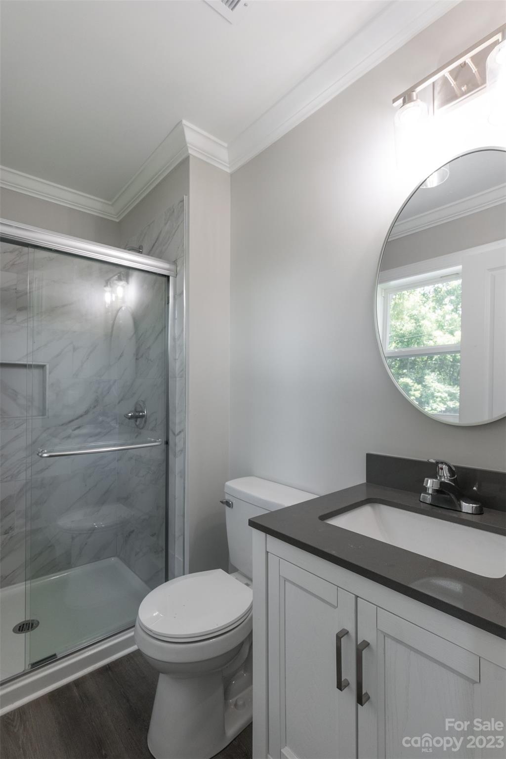 1531 Ruth Street, Unit 2 Lancaster, SC 29720 - Photo 23 of 33 a bathroom with a sink toilet and a mirror