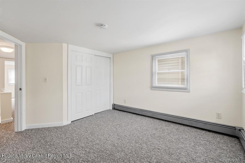 252-254 Partition Street Saugerties, NY 12477 - Photo 18 of 35 a view of an empty room with a window