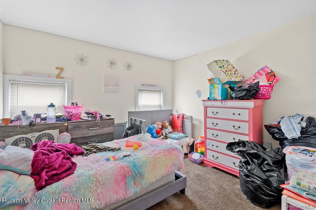 252-254 Partition Street Saugerties, NY 12477 - Photo 31 of 35 a bedroom with furniture and a bed