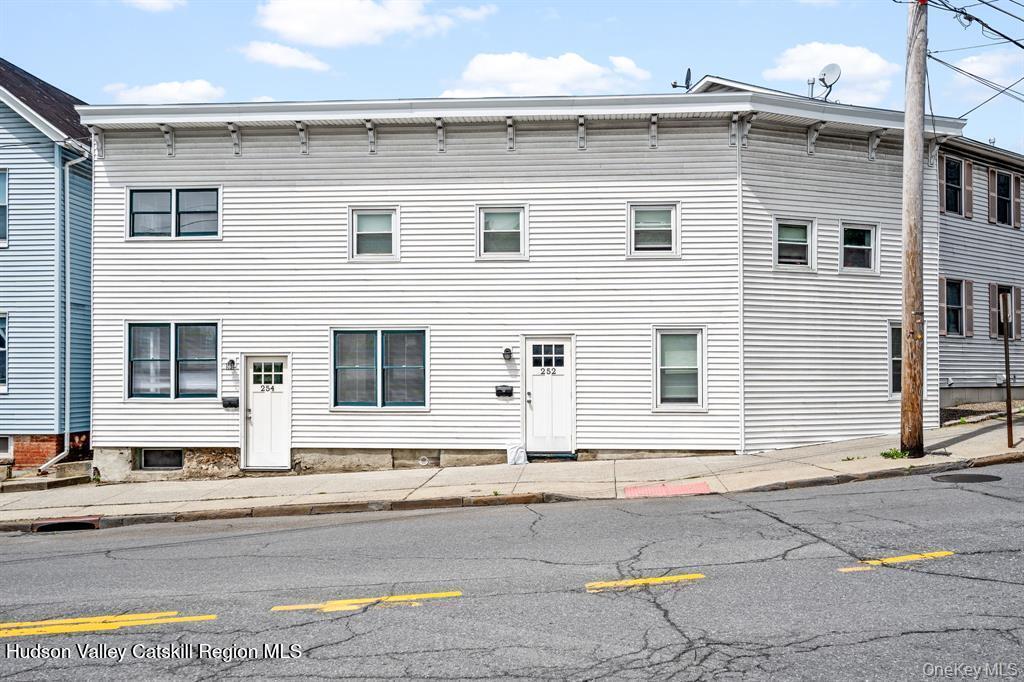 252-254 Partition Street Saugerties, NY 12477 - Photo 34 of 35 a brick house with a outdoor space