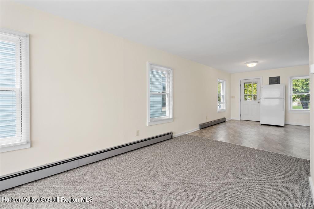 252-254 Partition Street Saugerties, NY 12477 - Photo 8 of 35 an empty room with windows