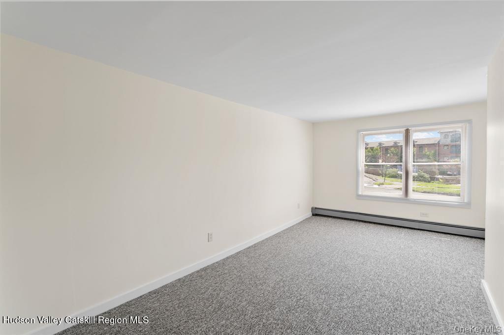 252-254 Partition Street Saugerties, NY 12477 - Photo 9 of 35 an empty room with windows