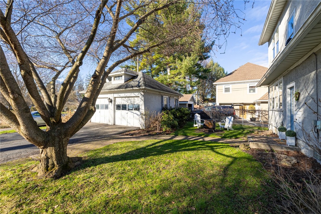 157 Sunset Drive Brighton, NY 14618 - Photo 31 of 32 Garage and backyard