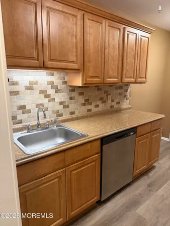 a kitchen with a stove and a refrigerator